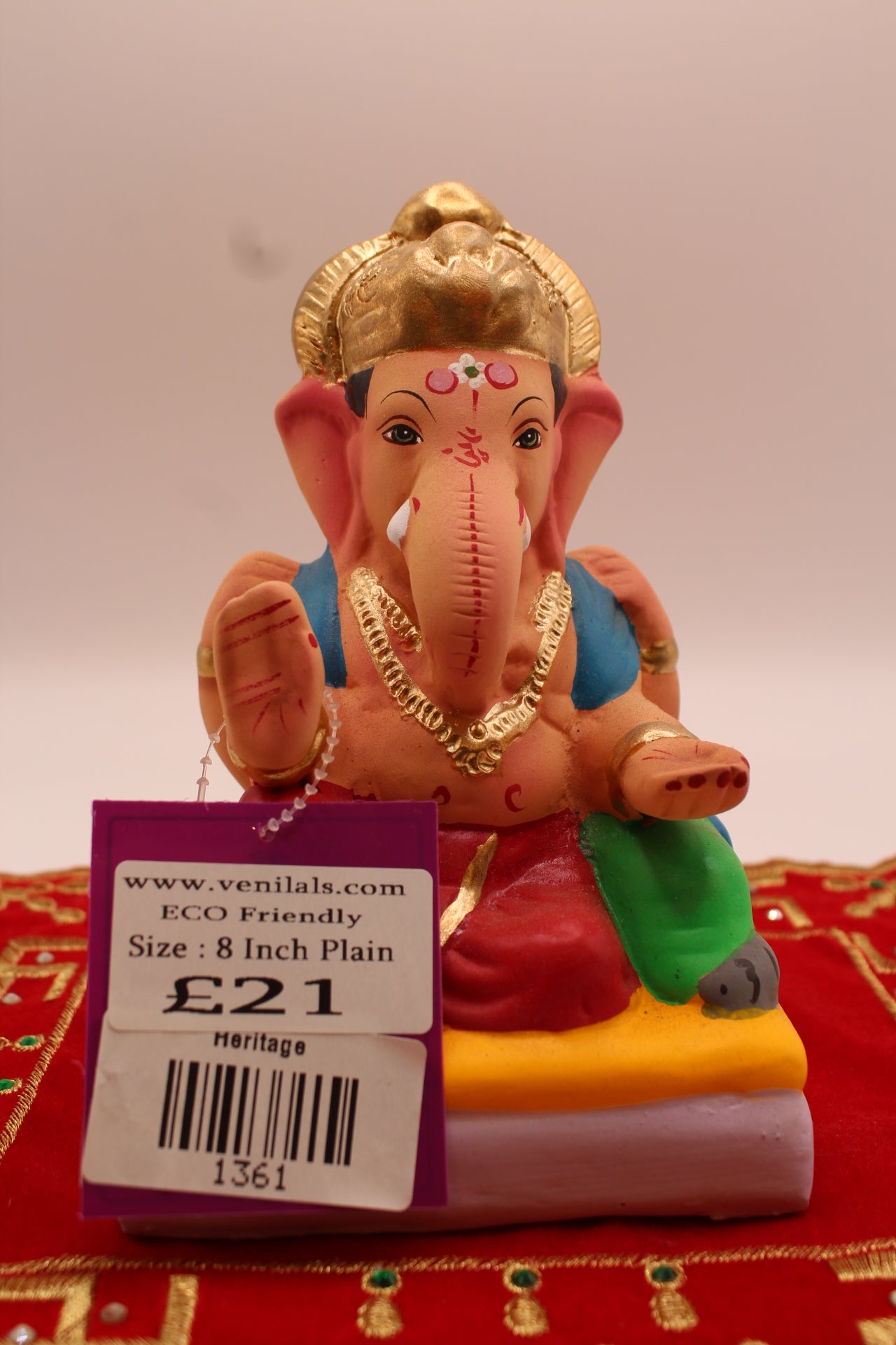 6 inch eco-friendly Ganesh idol, crimson dhoti and peacock blue khes, front