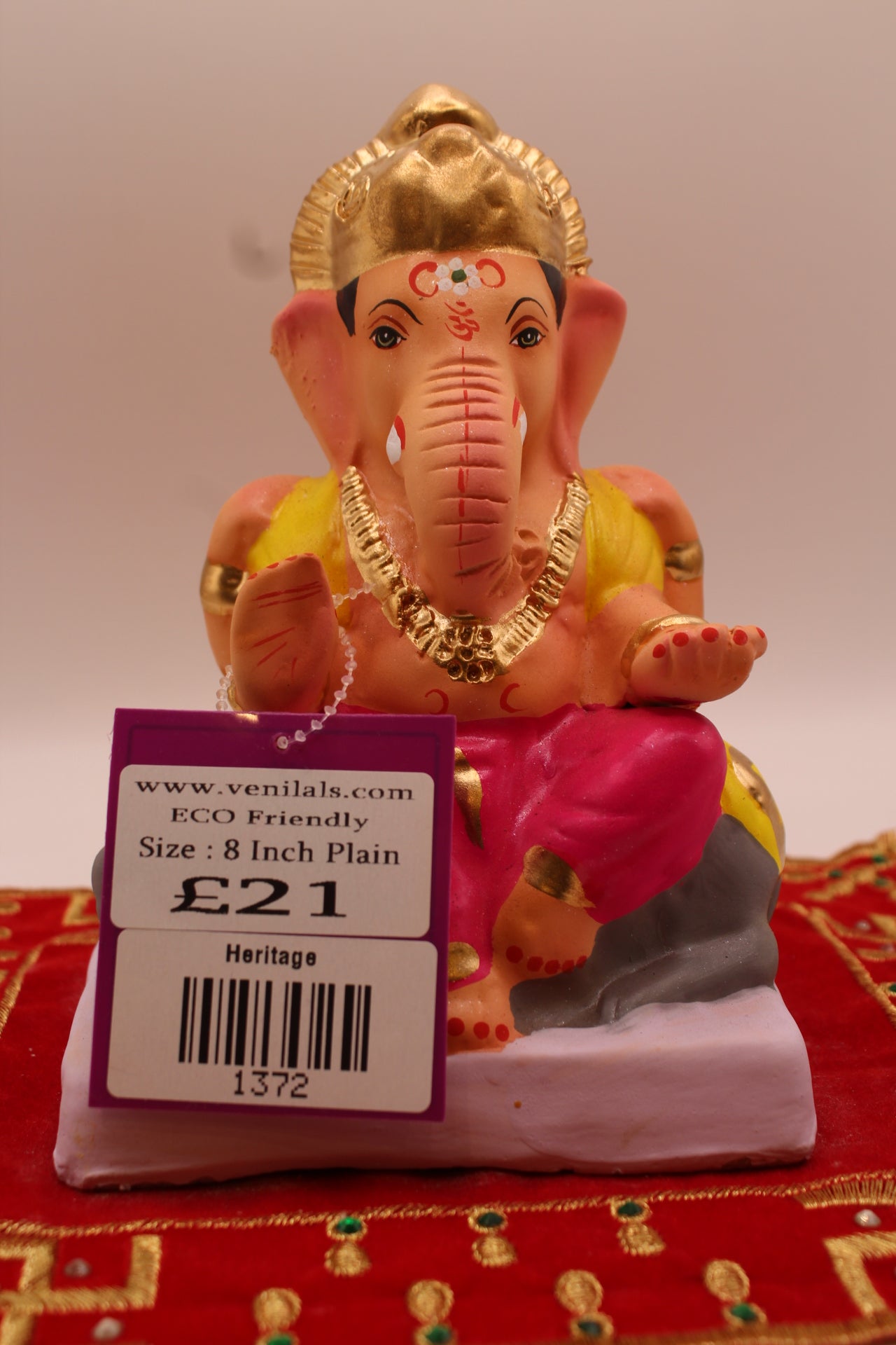 6 inch eco-friendly Ganesh idol, rani pink dhoti and lemon khes, front