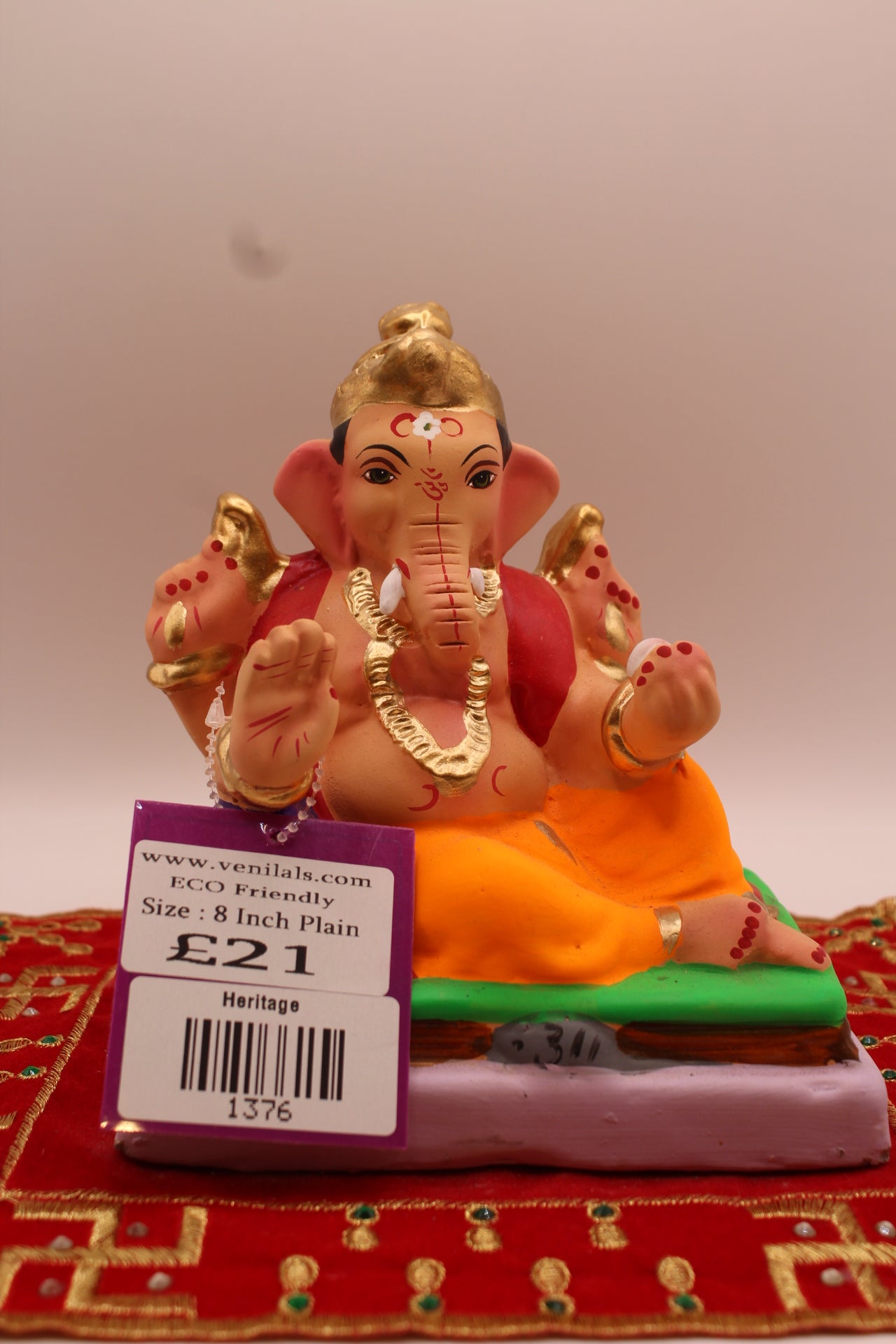 6 inch eco-friendly Ganesh idol on a green gadi, front