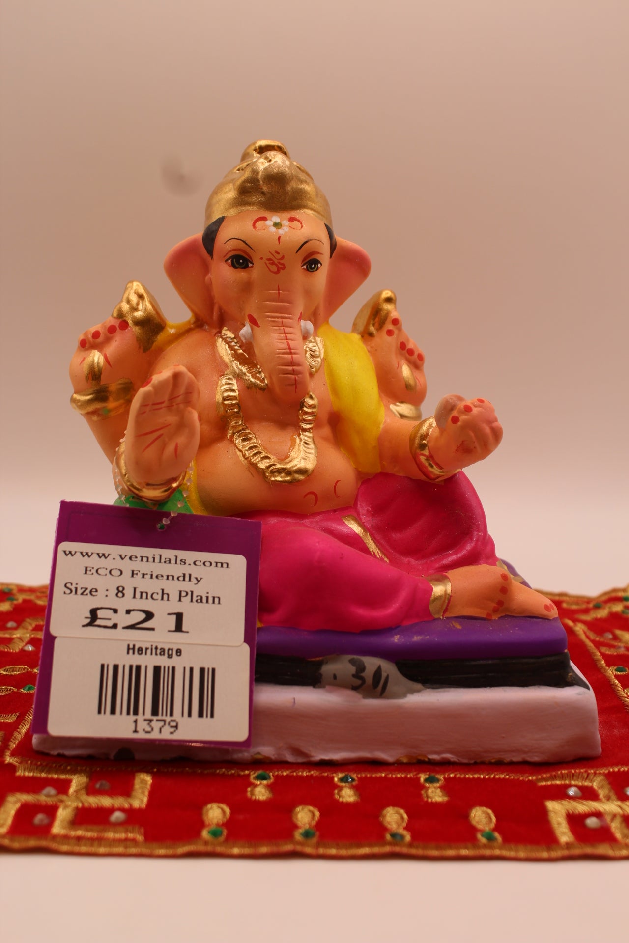 6 inch eco-friendly Ganesh idol with emerald bolster, front