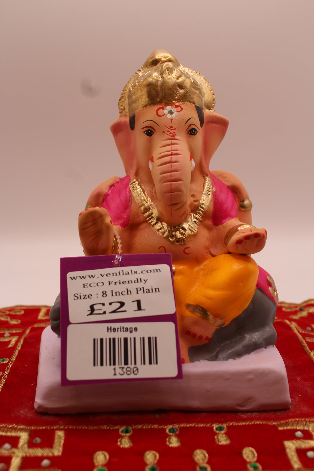 6 inch eco-friendly Ganesh idol with fuchsia fan-pleat khes, front