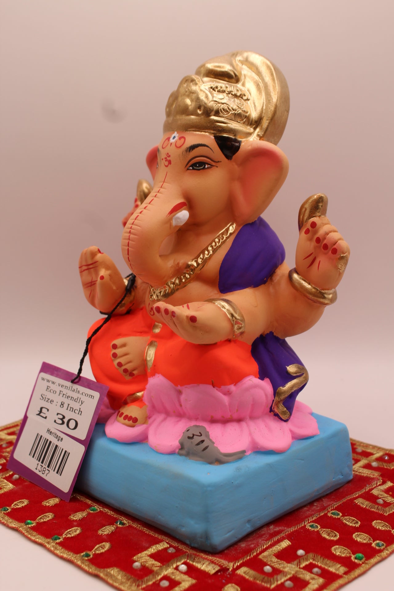 Angled view – purple khes and orange dhoti on a pink lotus base