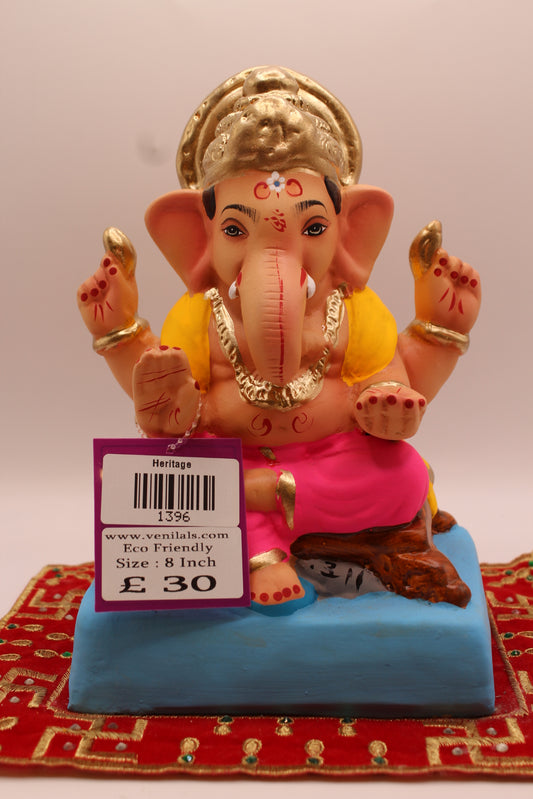8 inch eco-friendly Ganesh idol – yellow khes and pink dhoti seated on a wooden chowki, front