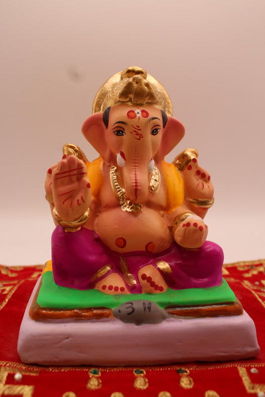 Eco-friendly 6 inch Ganesh idol, saffron khes and magenta dhoti, front view