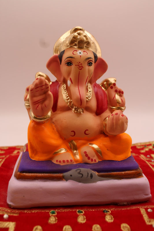 Eco-friendly 6 inch Ganesh idol, maroon khes and saffron dhoti, front view