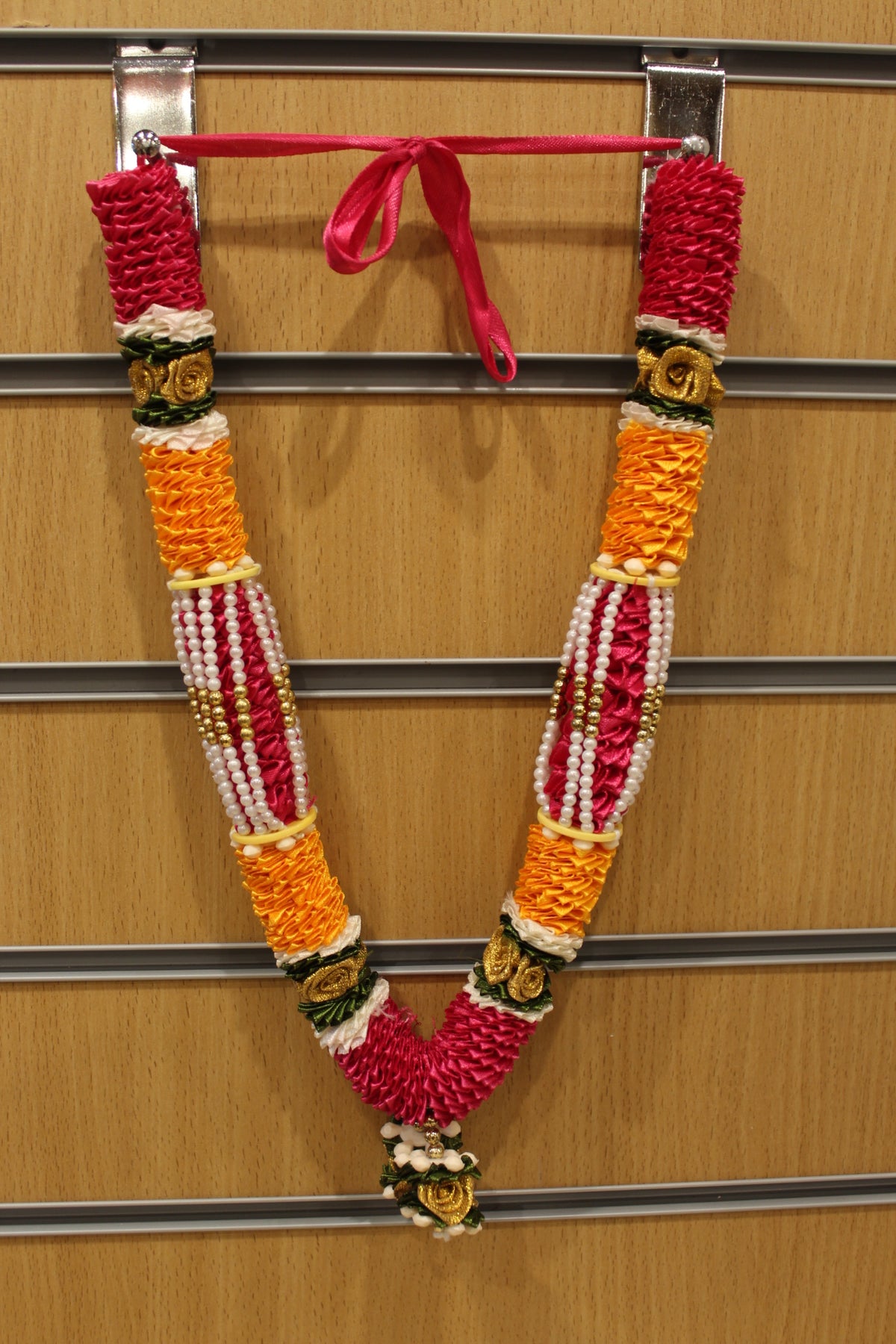 Pink and yellow artificial flower garland mala, hanging