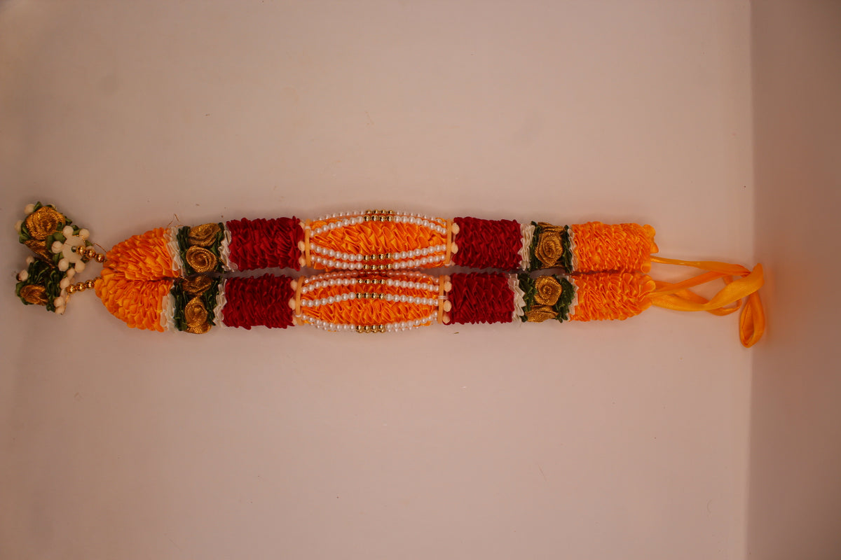 Yellow and red garland mala laid flat