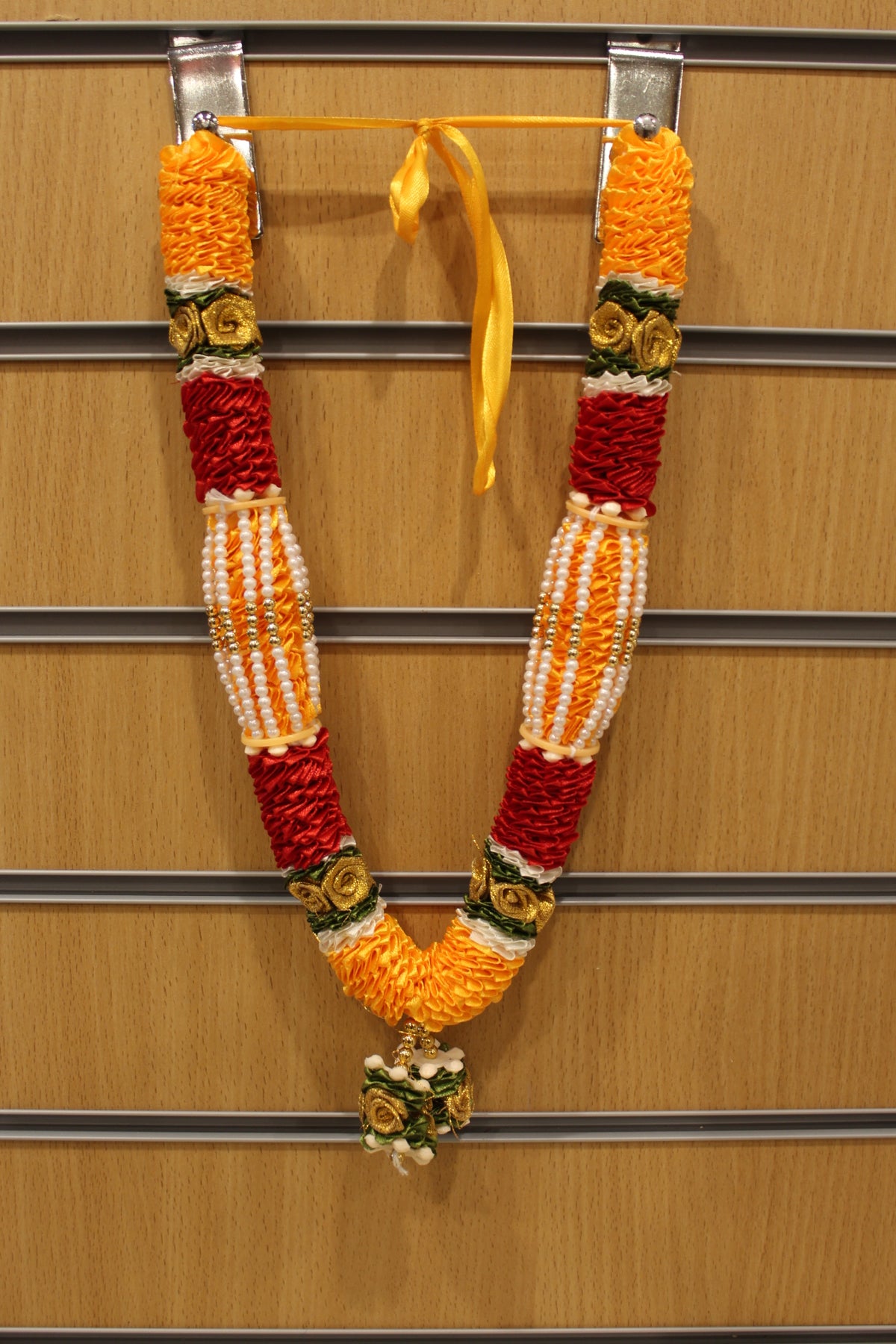 Yellow and red artificial flower garland mala, hanging