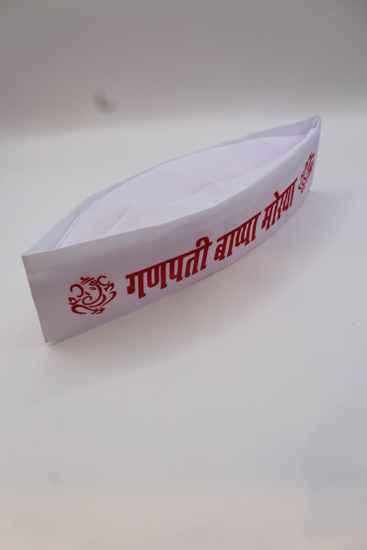 Gandhi topi with Ganpati Bappa Morya print, side view