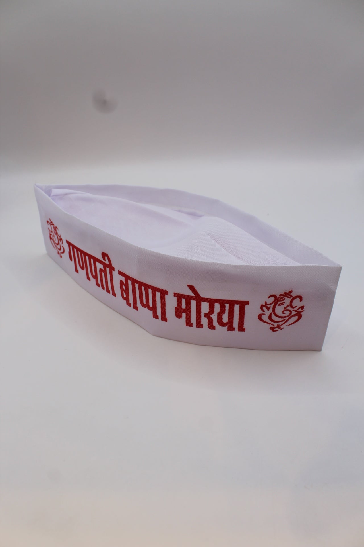 Gandhi topi with Ganpati Bappa Morya print, top view