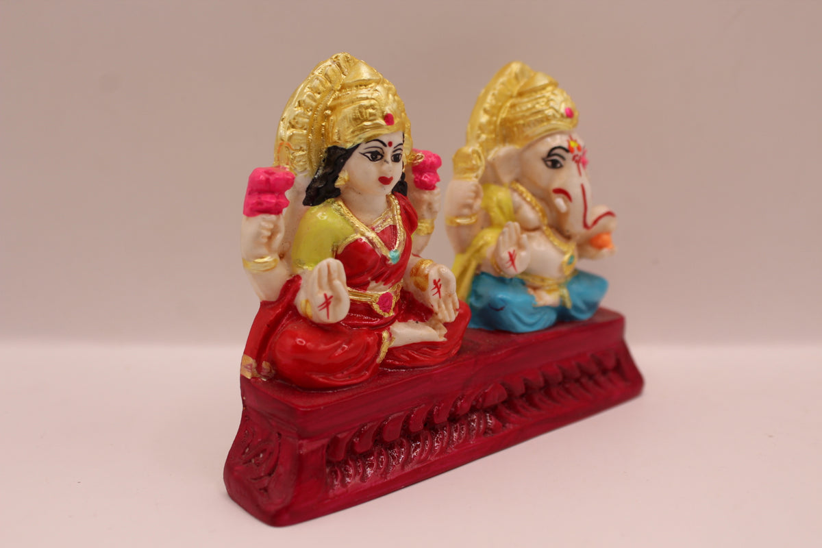Hand painted Ganesh Laxmi resin murti pair, left side view
