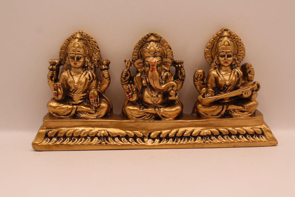 Antique gold Ganesh Laxmi Saraswati resin murti trio, front view