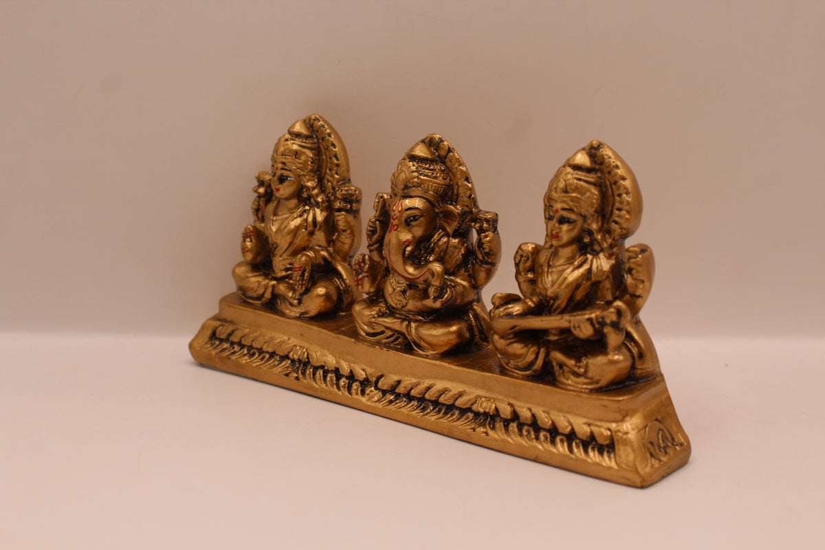 Antique gold Ganesh Laxmi Saraswati resin murti trio, right side view
