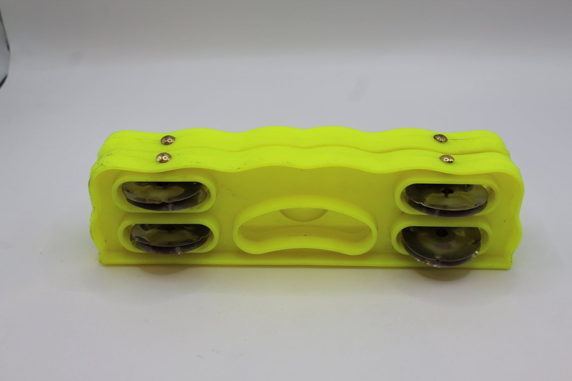 Yellow plastic kartal manjeera twin set — angled