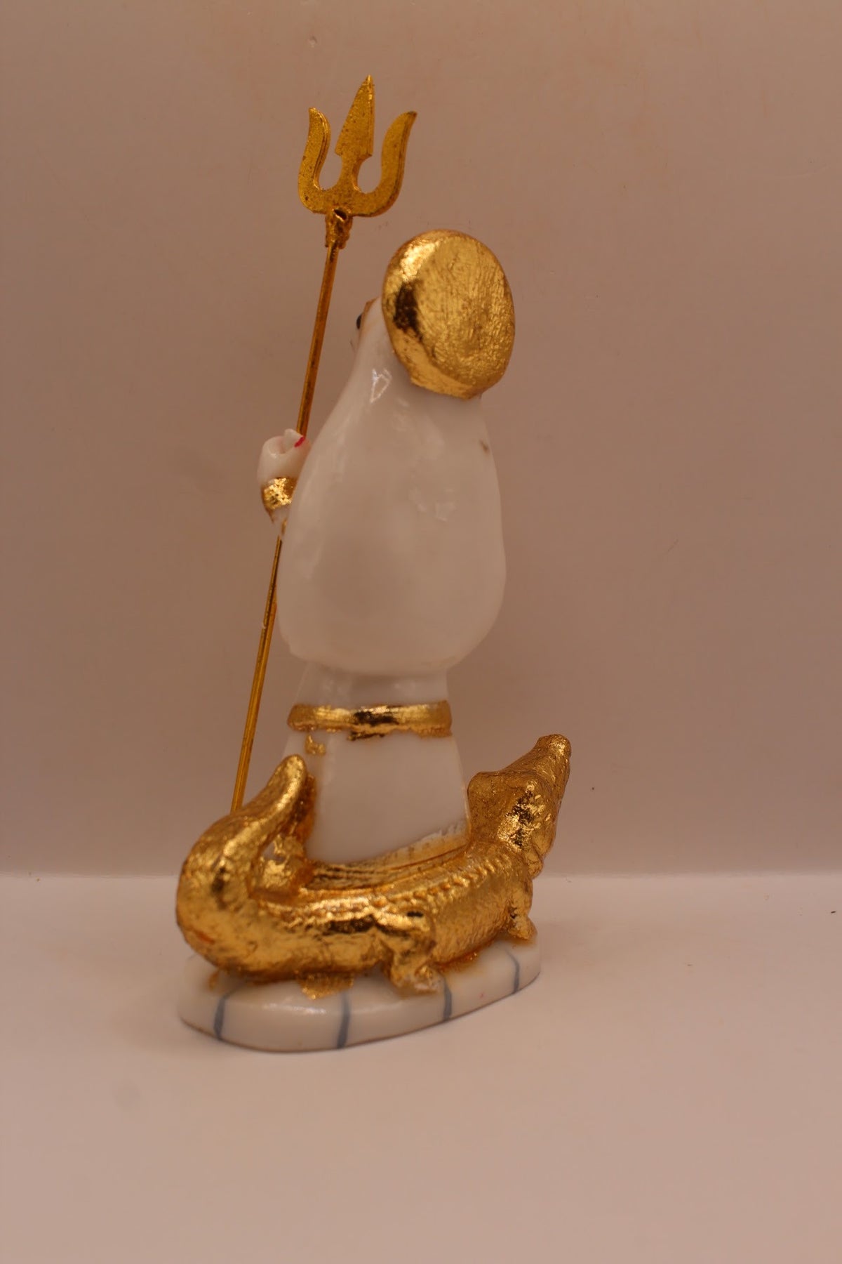 Resin Khodiyar Maa murti standing on a crocodile, back view