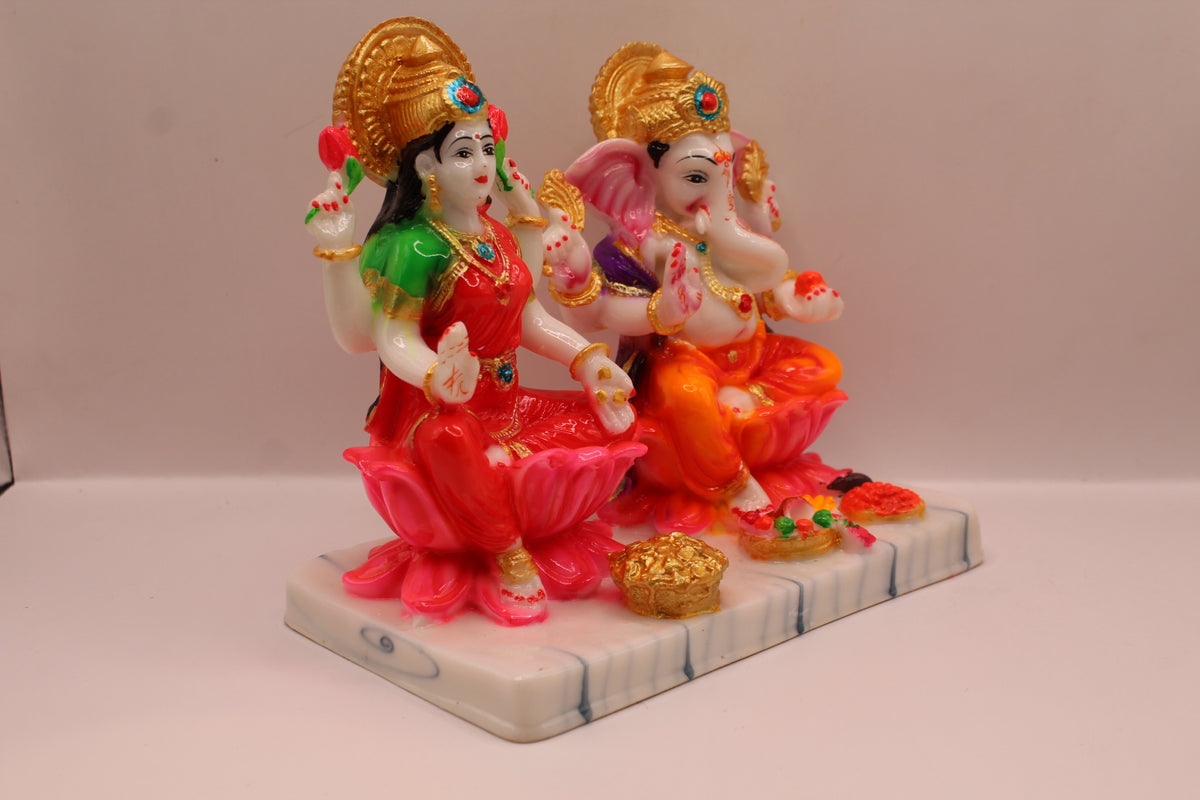 Resin Laxmi Ganesh murti pair on lotus seats with white base, left side view
