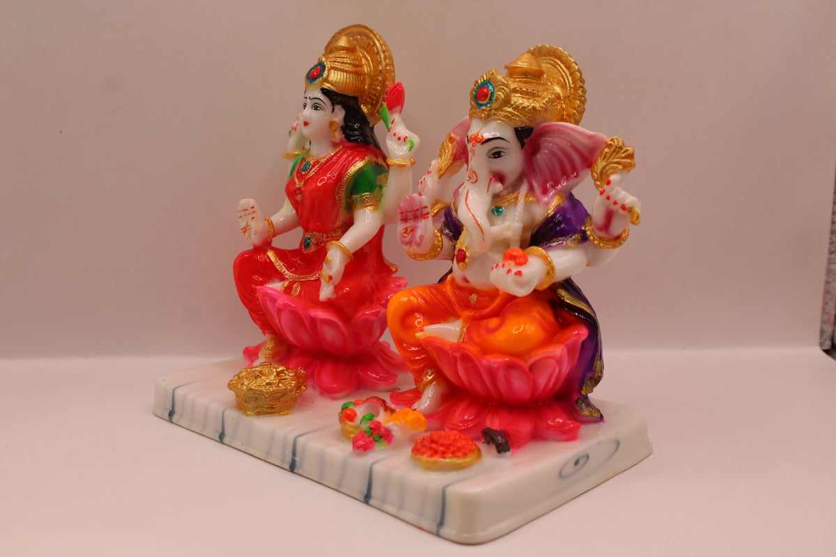 Resin Laxmi Ganesh murti pair on lotus seats with white base, right side view