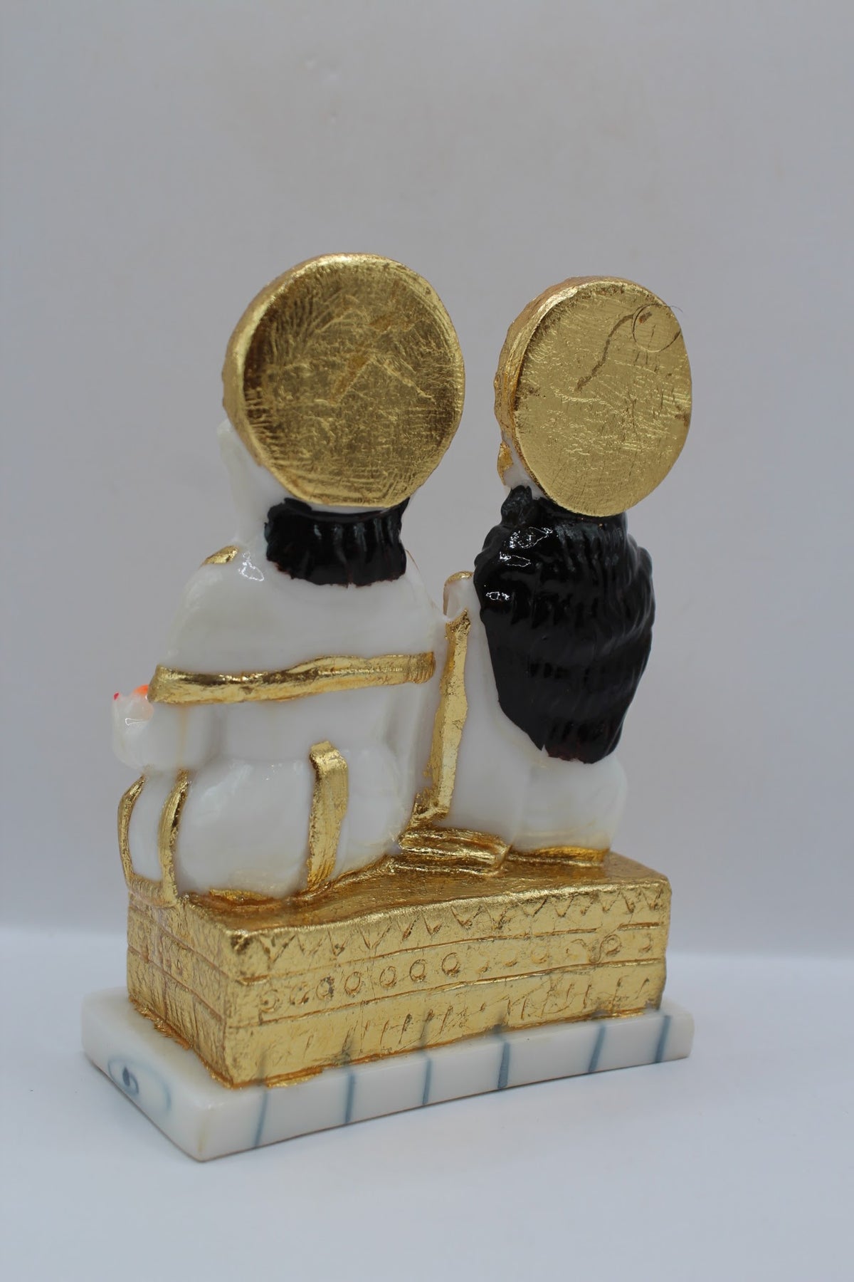 White and gold resin Laxmi Ganesh murti pair, back view