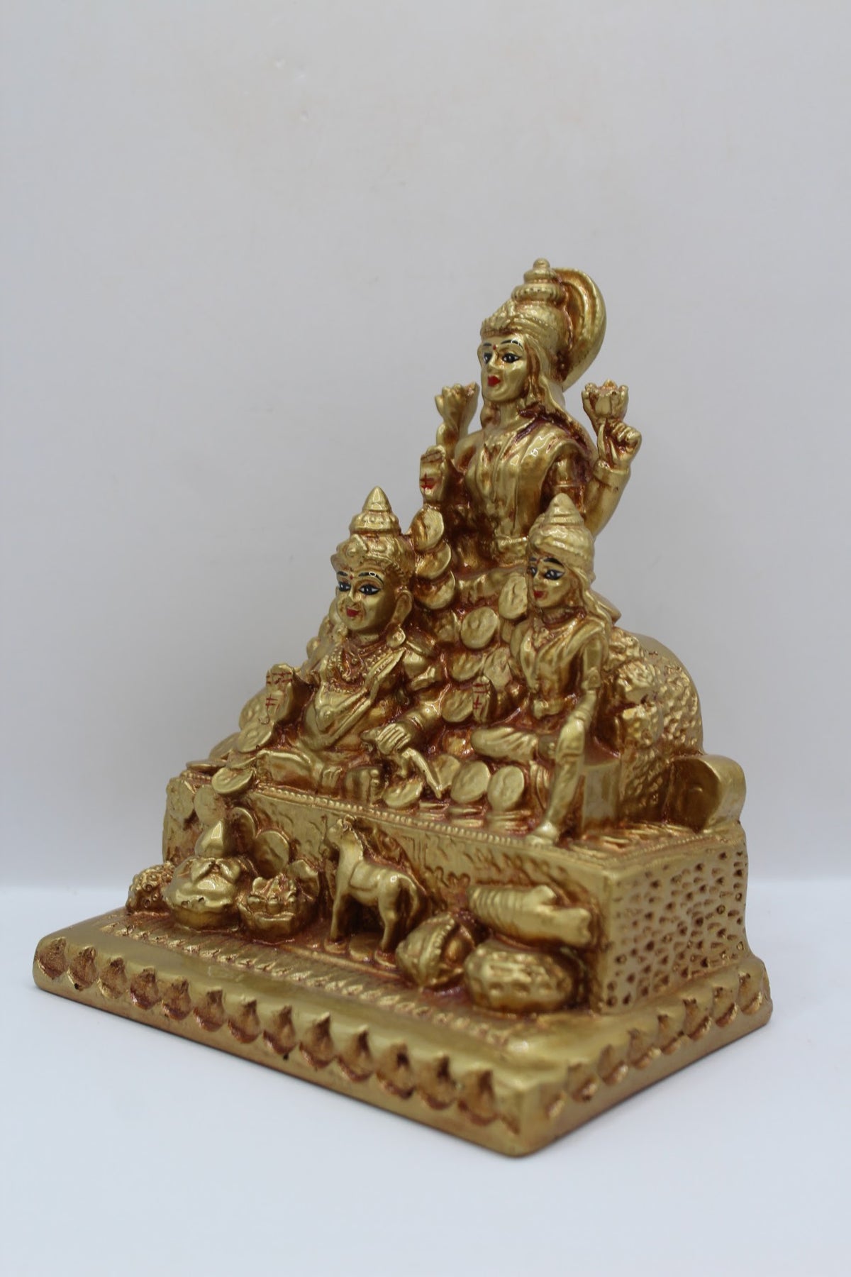 Gold resin Laxmi Kuber murti with coins, right side view