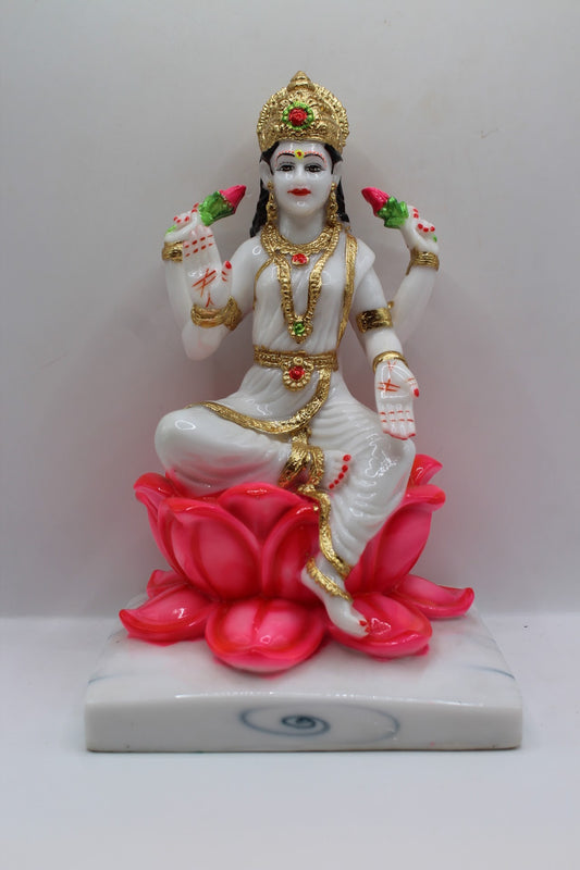White and gold resin Laxmi murti on a pink lotus, front view