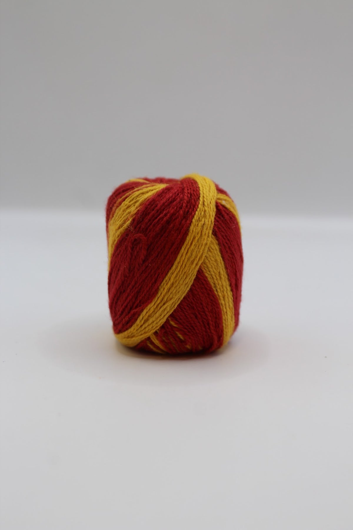 Red and yellow mauli kalawa thread roll
