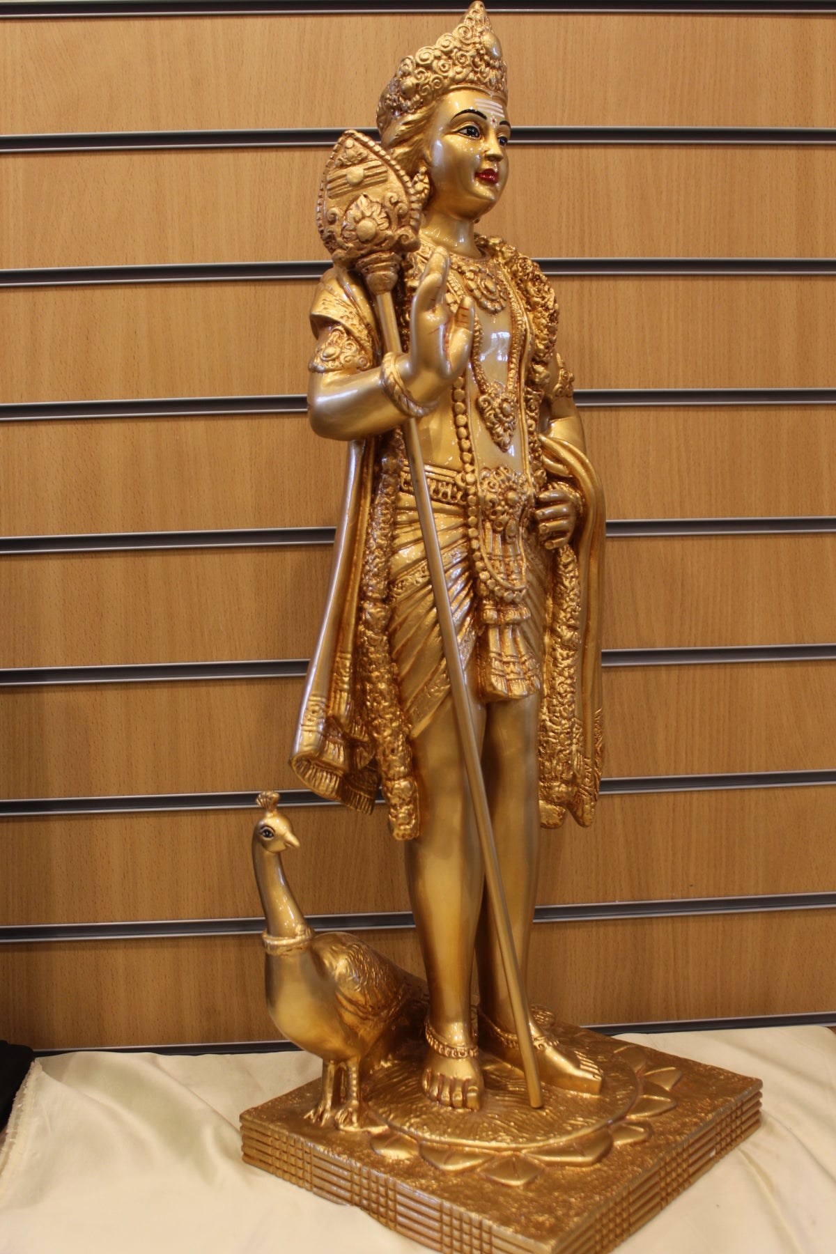 Resin Murugan Statue – Standing with Vel and Peacock, Gold, 29 inch – left side view