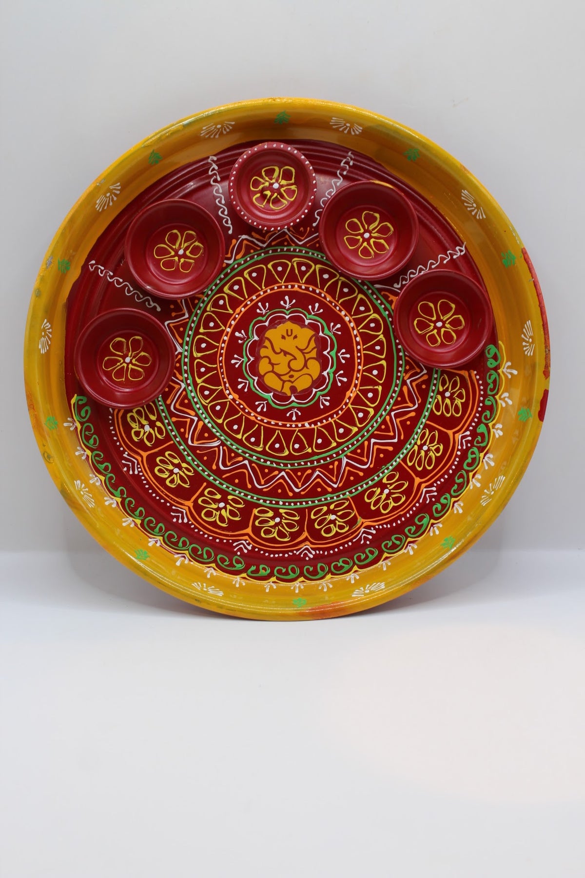 Painted steel pooja thali, yellow and red with katoris