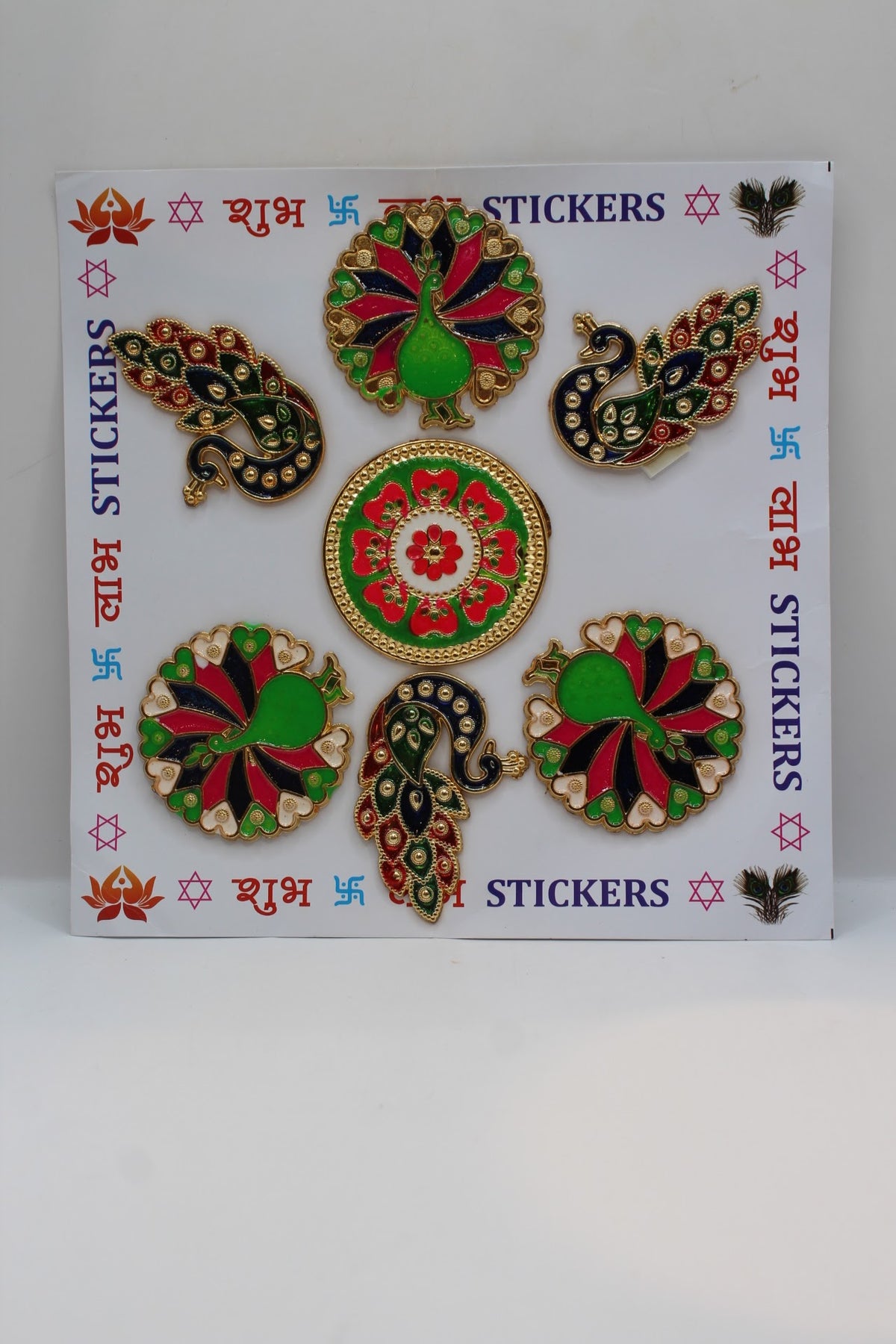 Rangoli stickers, green peacock and flower design on Shubh Labh sheet