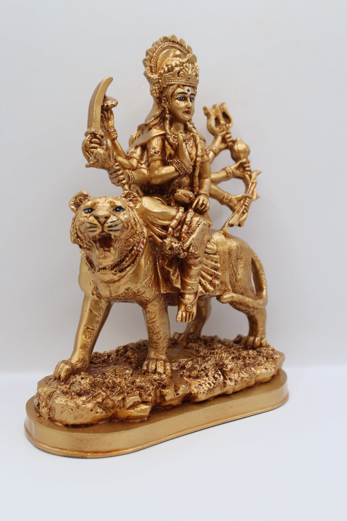 Resin Ambe Maa statue, golden finish, oval base, left side view