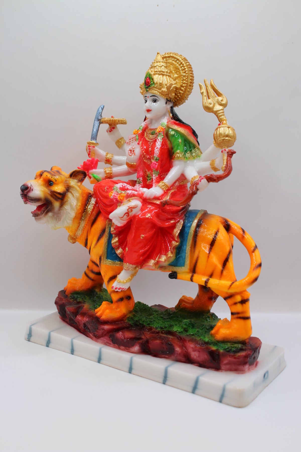 Resin Ambe Maa statue, red dress on tiger, white base, right side view