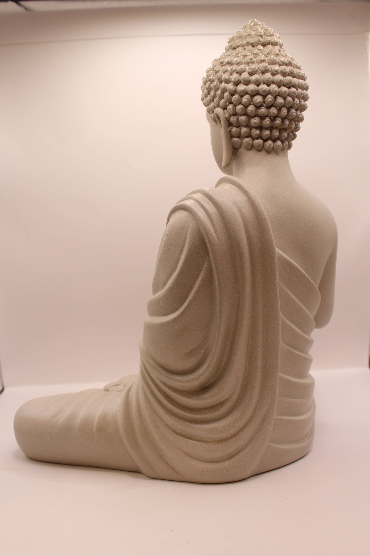 Grey Buddha statue, back