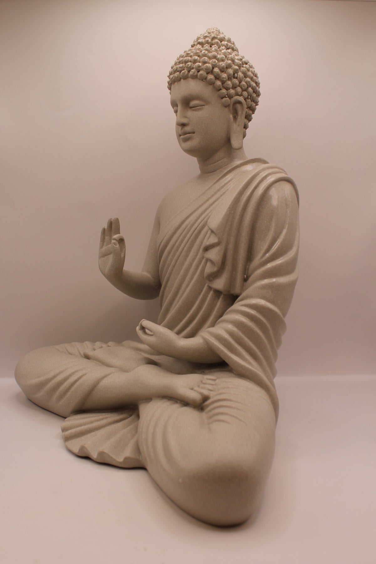 Grey Buddha statue, right side