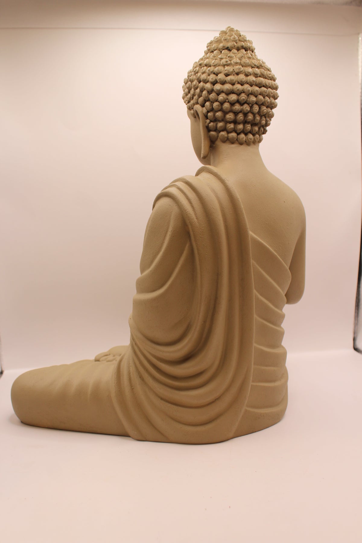 Light greige Buddha statue, back