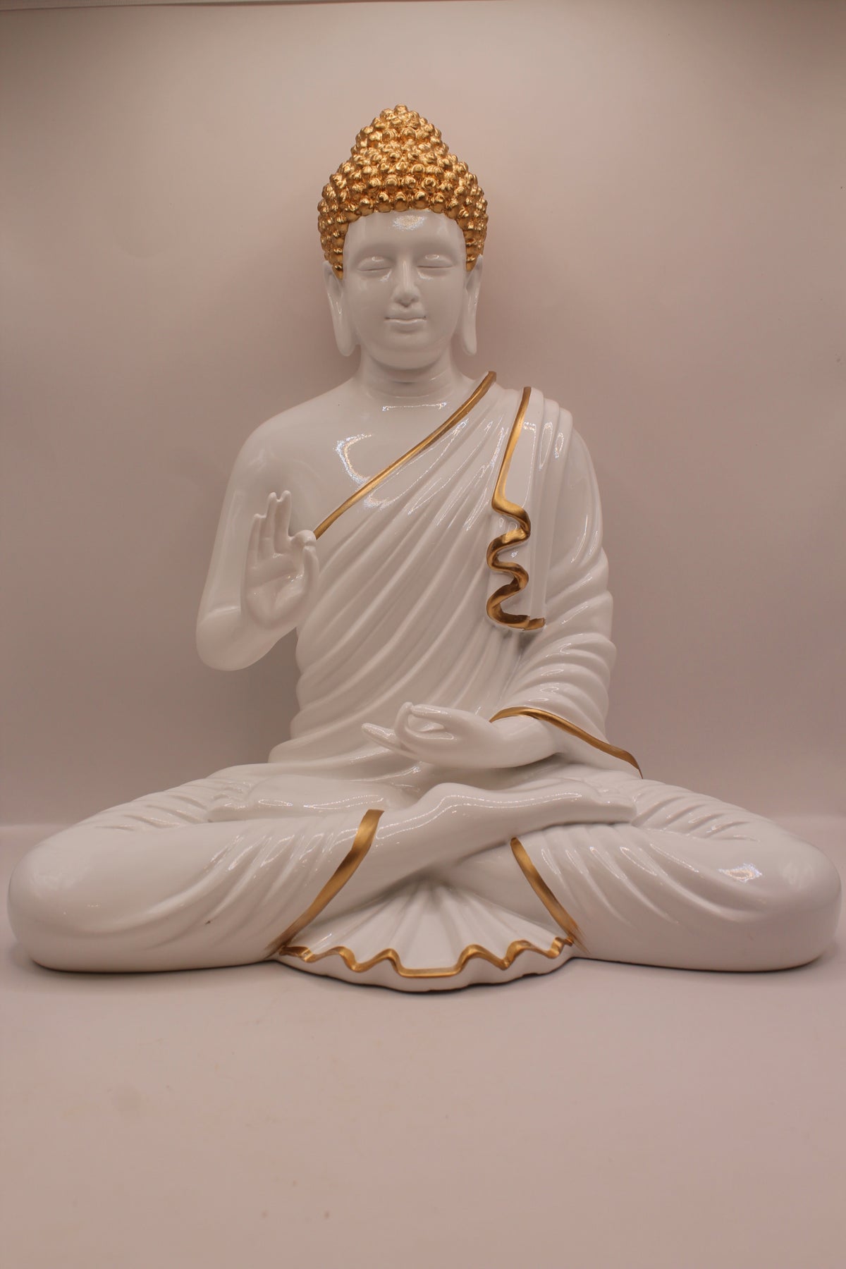 Resin Buddha statue with white and gold robe, front