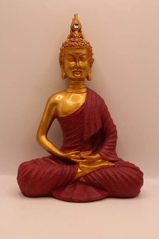 Small meditating Buddha statue, gold with maroon robe, front