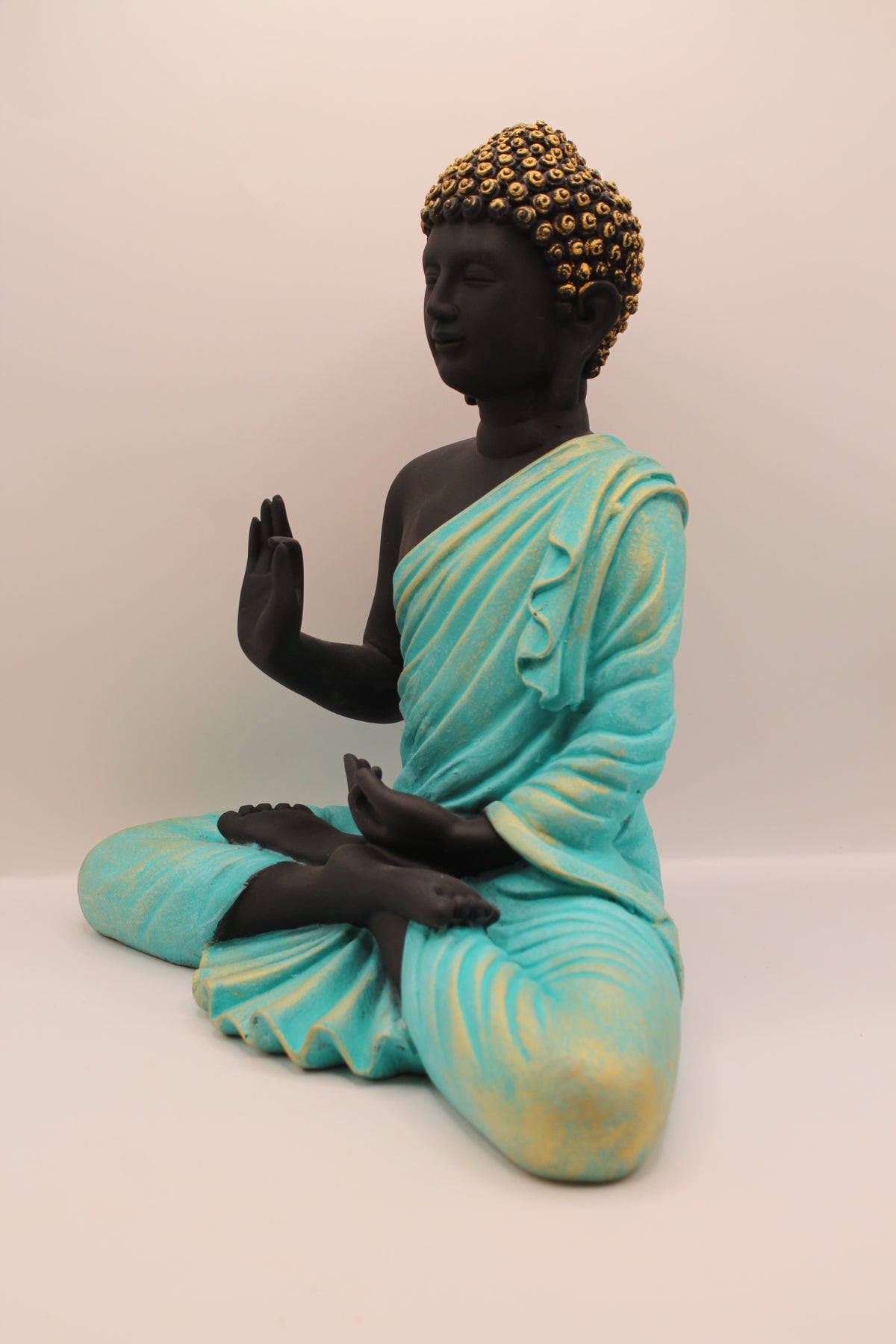 Sea blue and black Buddha statue, right side