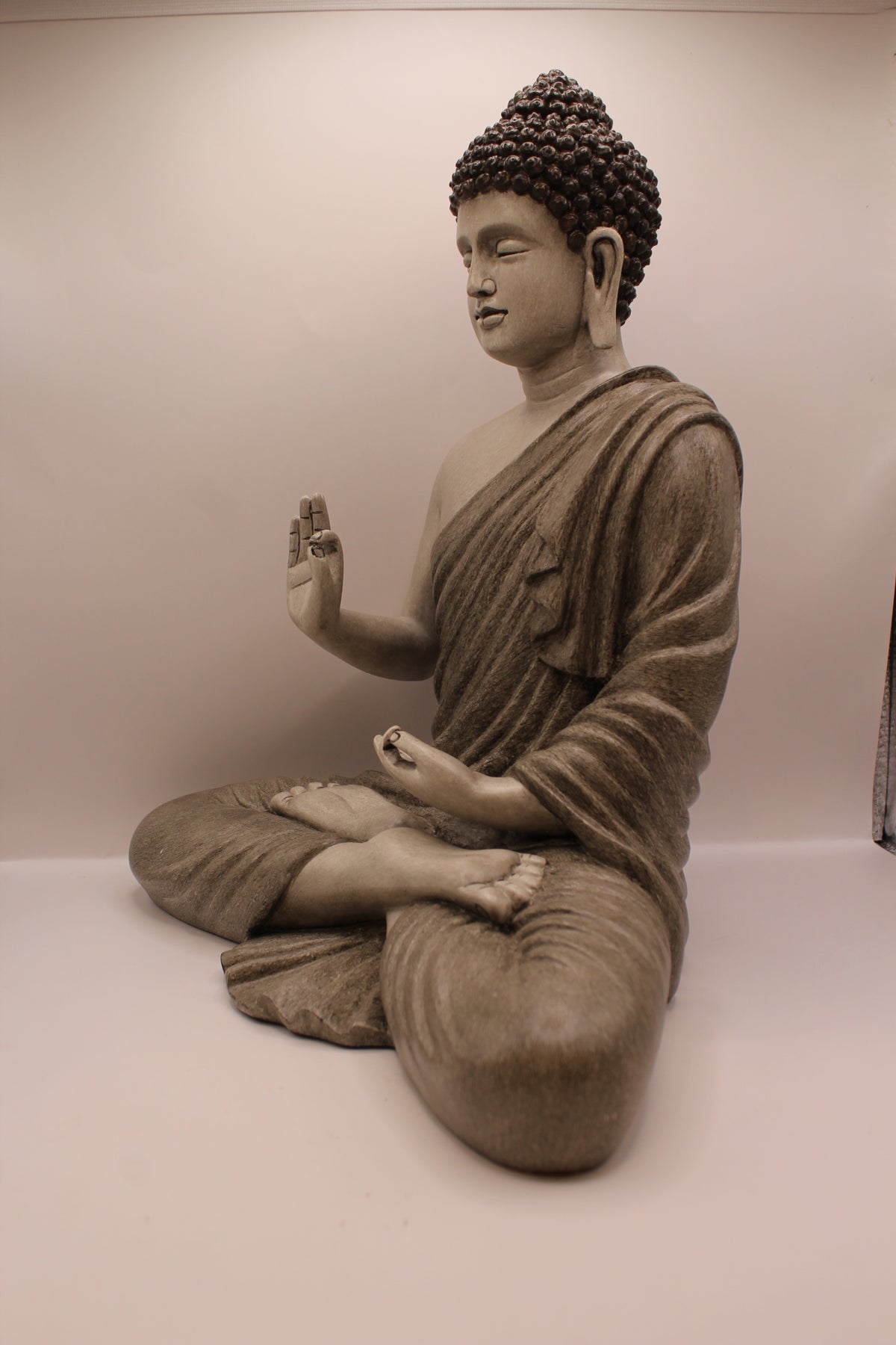 Slate grey Buddha statue, right side