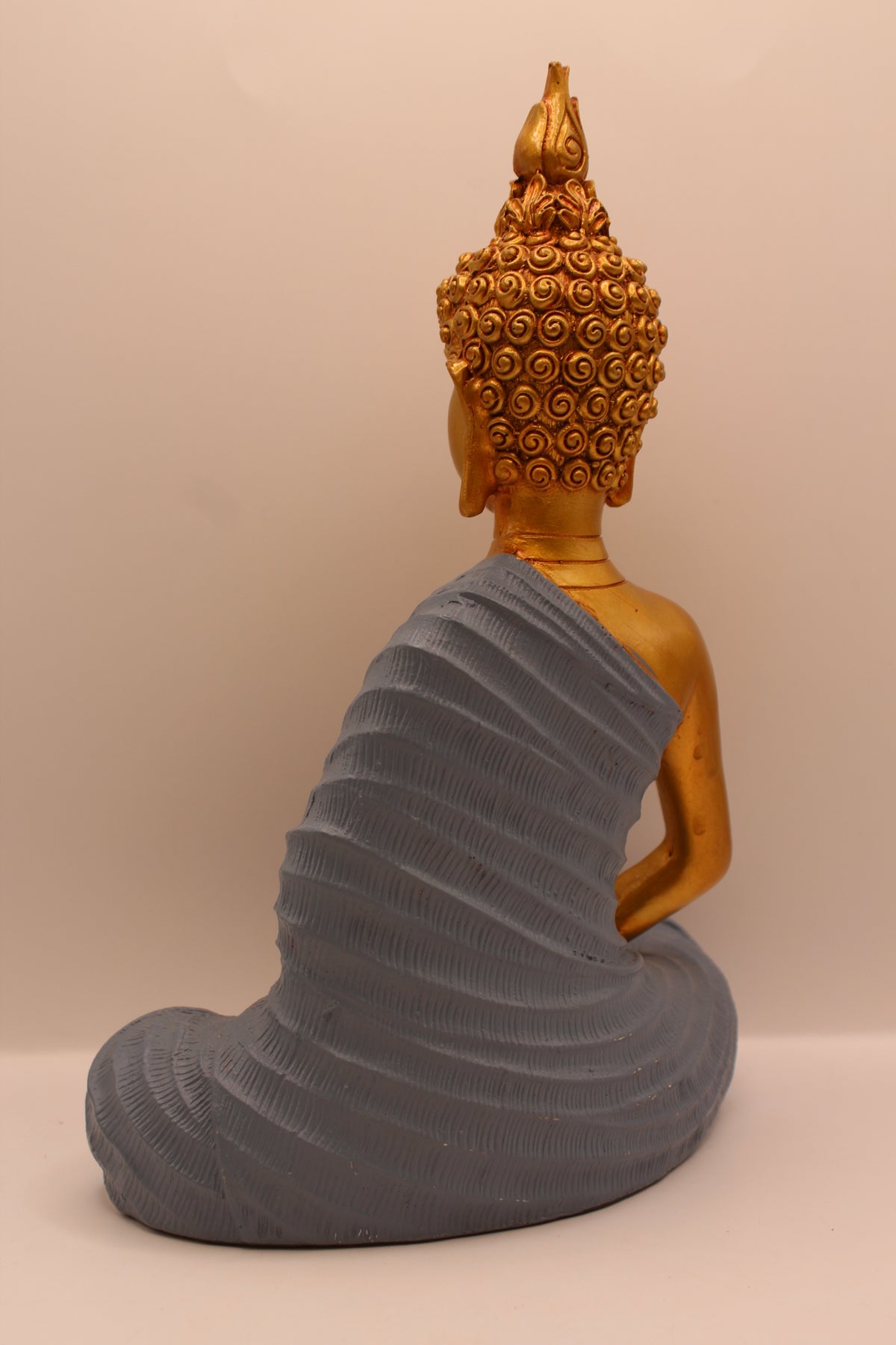 Slate grey meditating Buddha statue, back