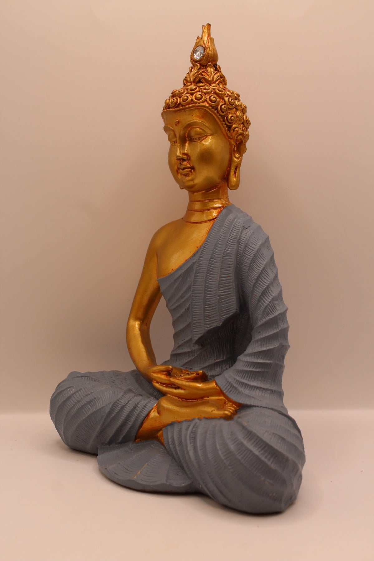 Slate grey meditating Buddha statue, right side