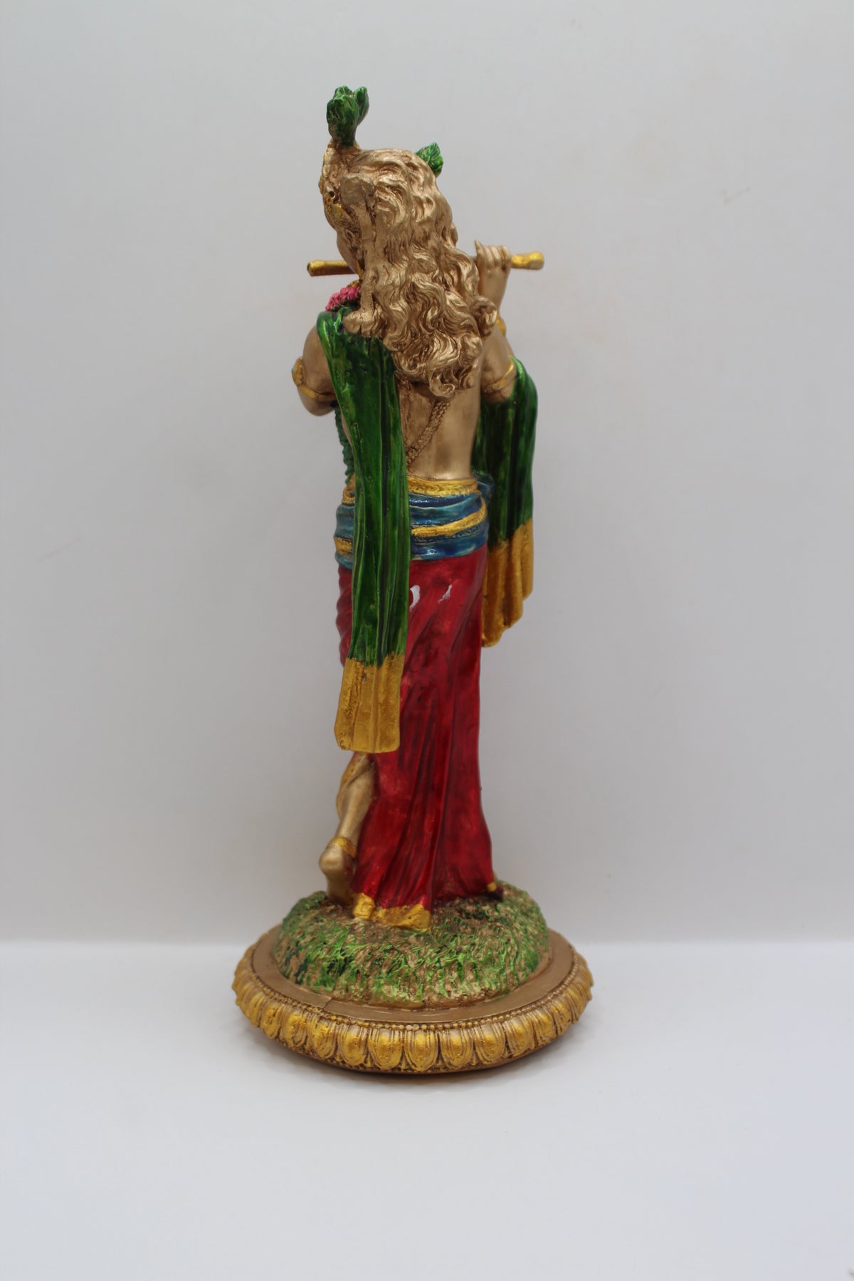 Resin Krishna statue, playing flute, antique bronze, back view