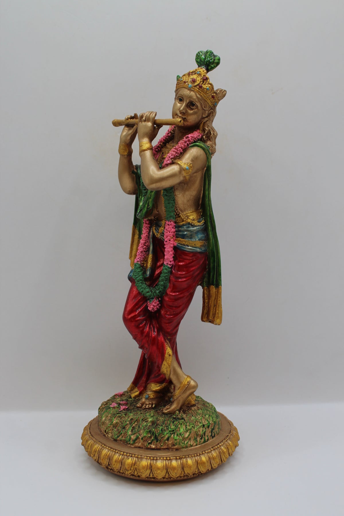 Resin Krishna statue, playing flute, antique bronze, right side view
