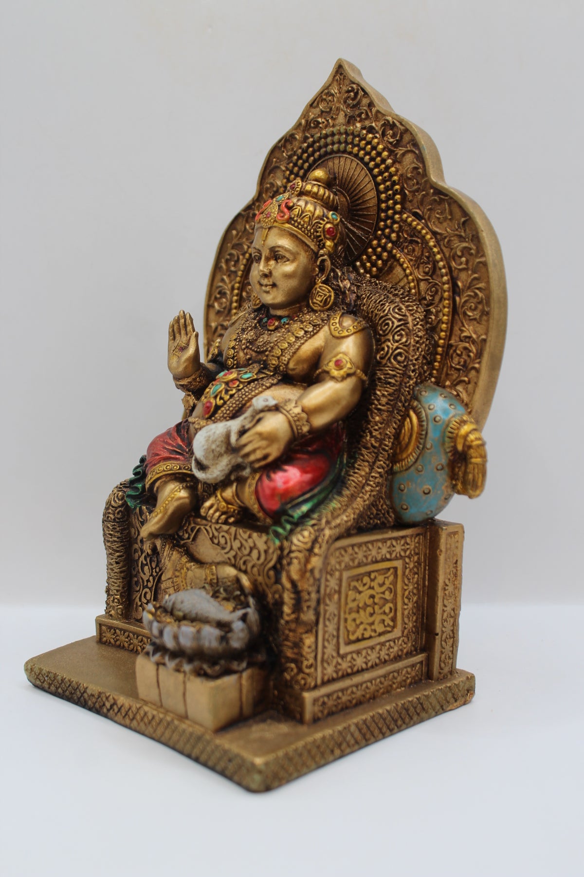 Resin Kuber statue, seated on throne, antique bronze, right side view