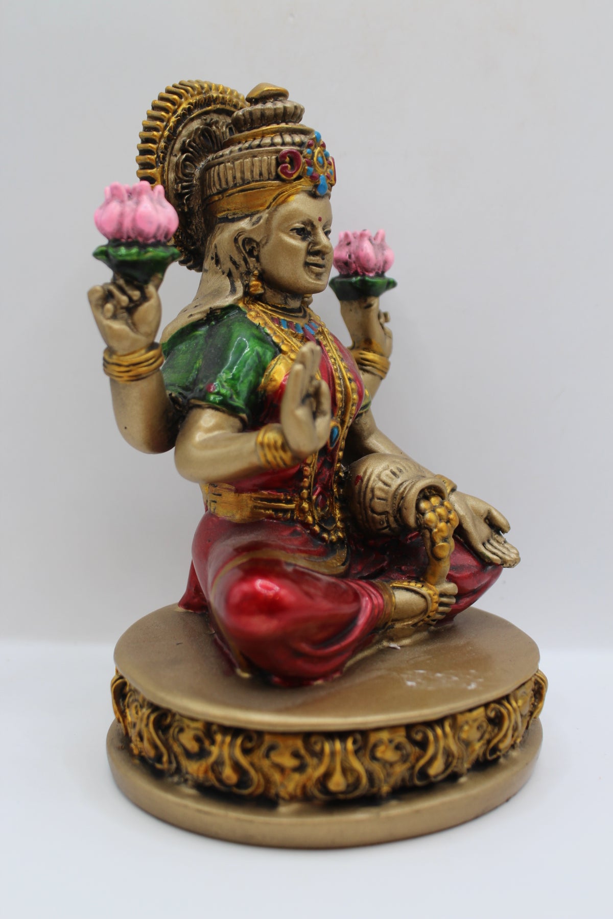 Resin Laxmi statue, with lotus flowers, antique bronze, left side view