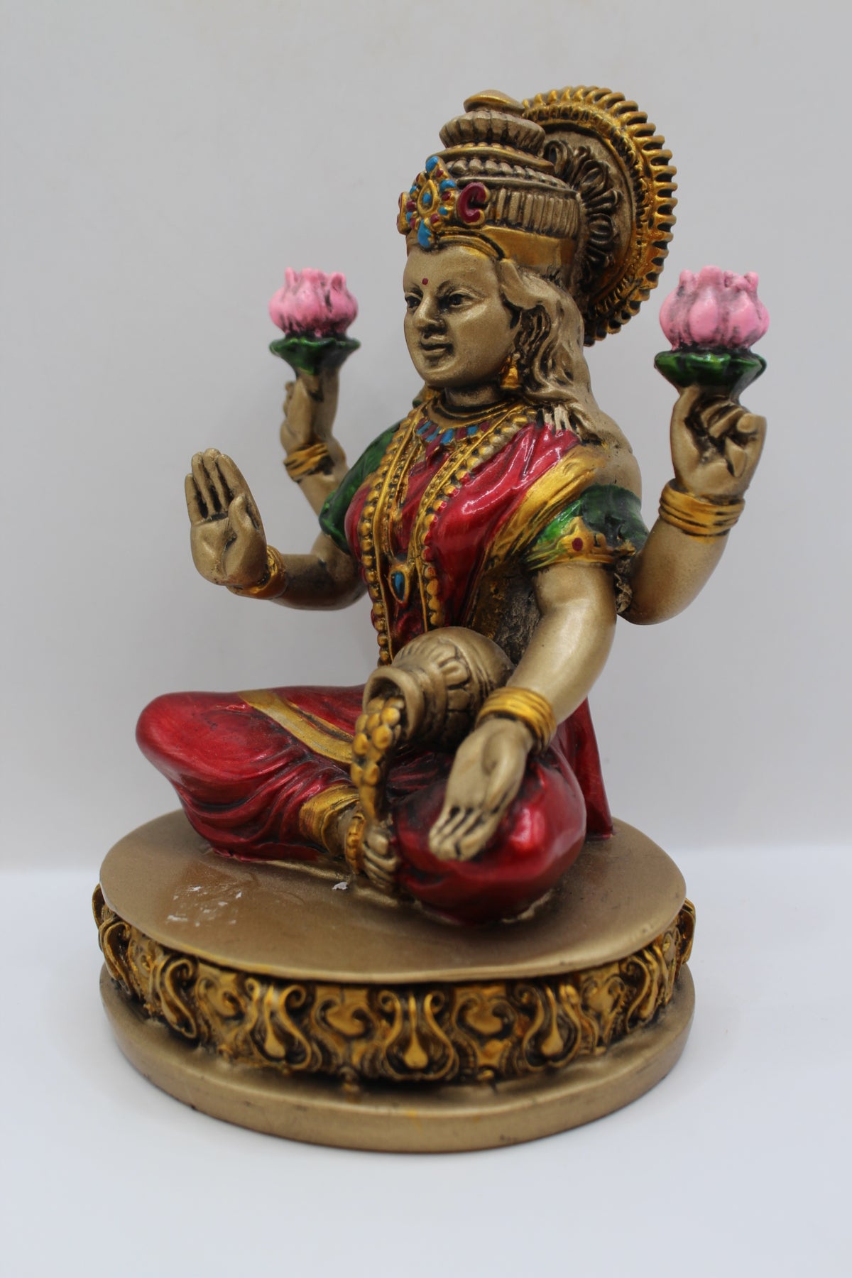 Resin Laxmi statue, with lotus flowers, antique bronze, right side view