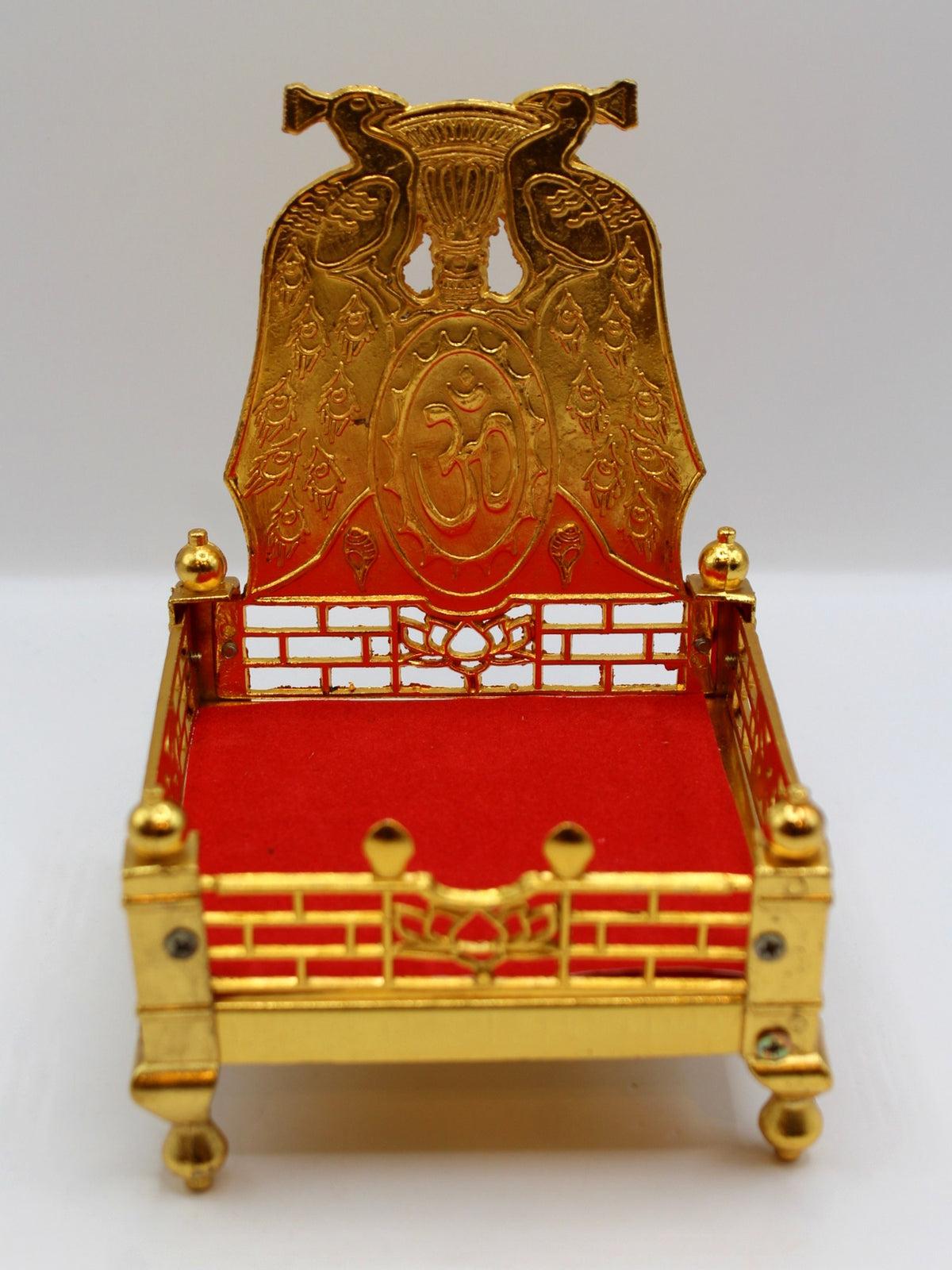 Gold metal sinhasan with red velvet seat, 10 x 10 x 15, front view