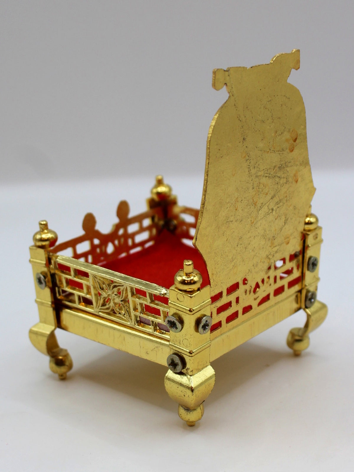 Gold metal sinhasan, 6 x 6 x 10, showing jaali sides and velvet seat