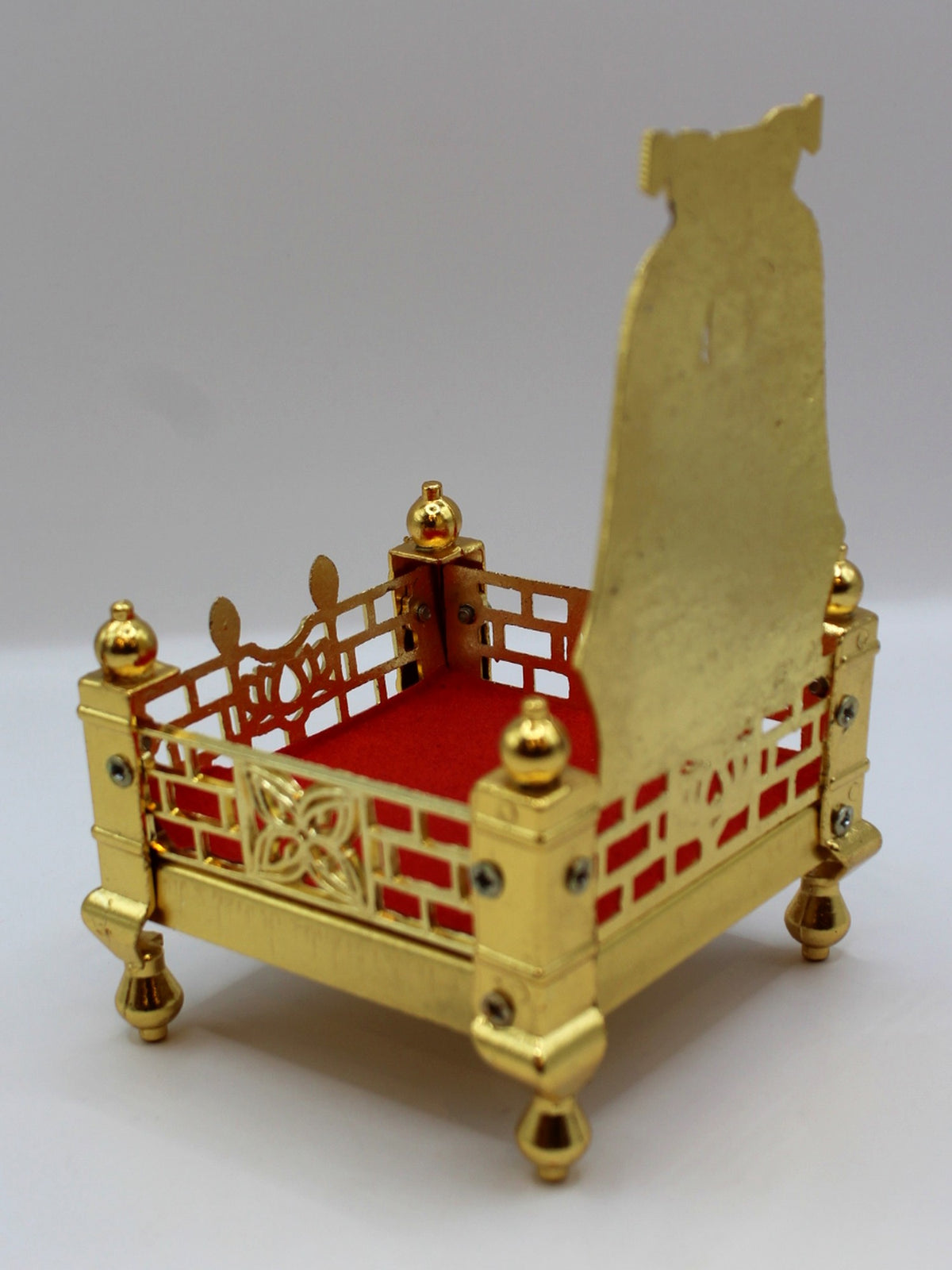 Gold metal sinhasan, 9 x 9 x 15, showing jaali sides and velvet seat