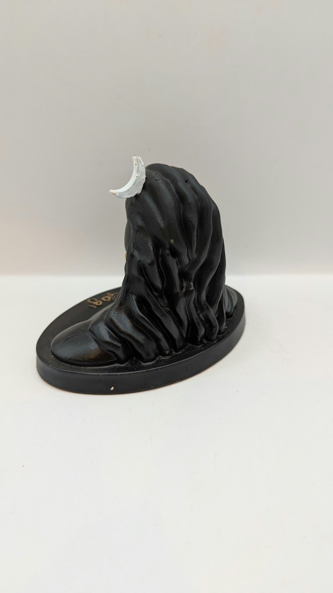 Black Adiyogi Shiva statue, back view