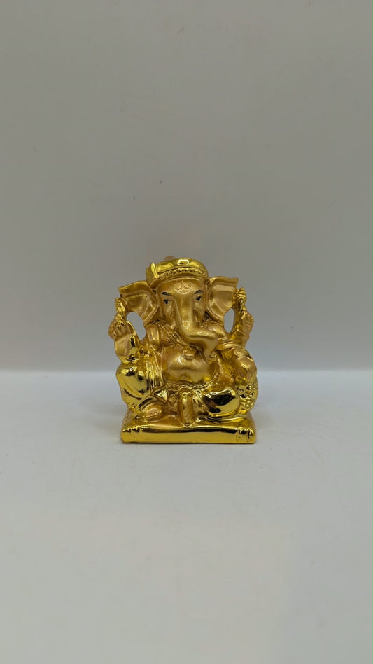 Small gold Ganesh statue, front view