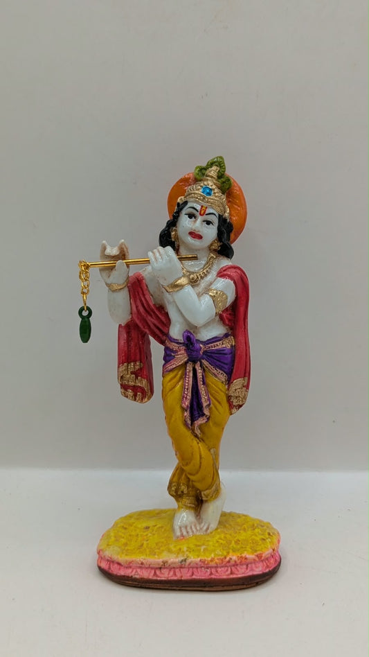 Colourful Lord Krishna statue with flute, front view